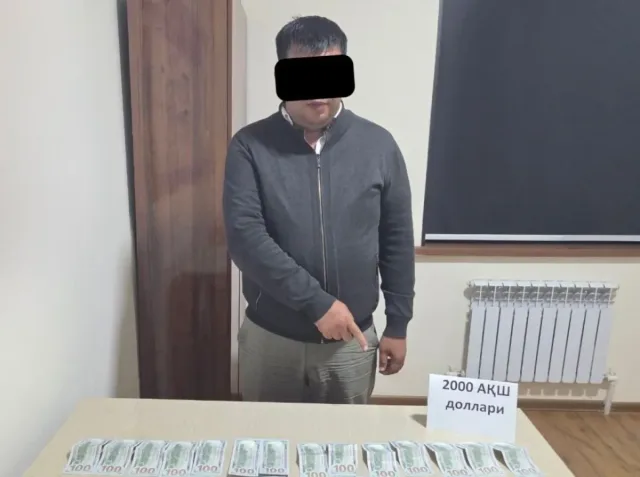 Qoraqalpog'istonda 2 ming dollar pora olgan kadastr rahbari ushlandi